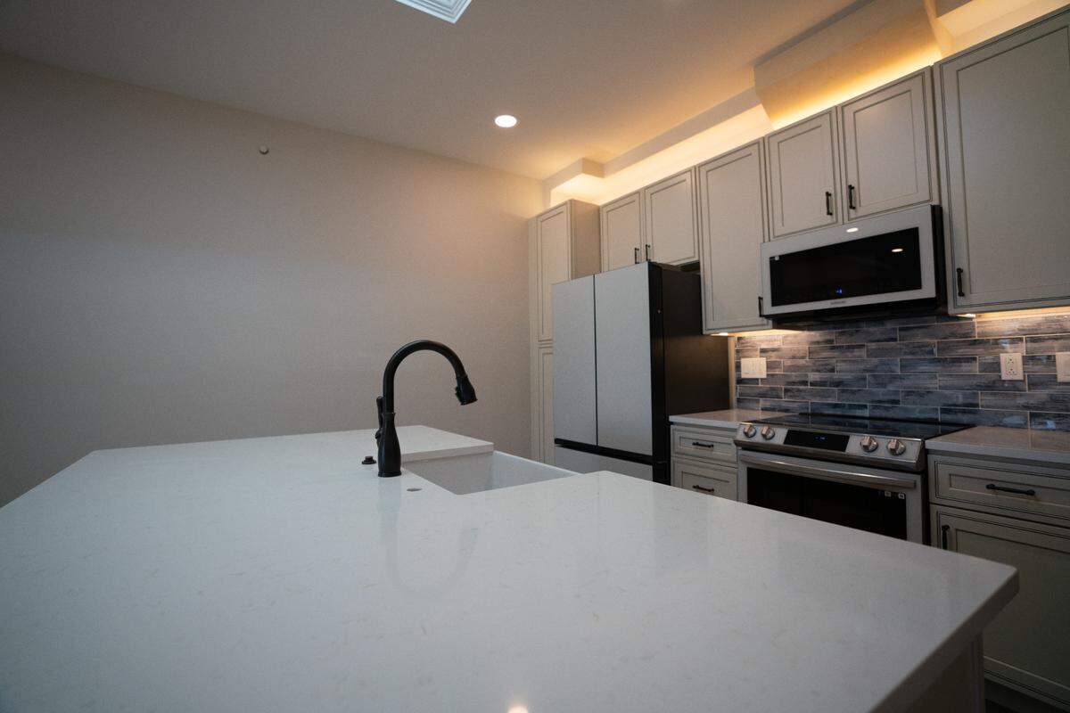 Inside of the luxury apartments at 300 E. Main St. in Belleville, Ill. on Nov. 8, 2023. All units are equipped with state-of-the-art appliances and those on the top floor have skylights. “The exposed brick is the only old thing left in the building,” owner Karl Gilpin said.
