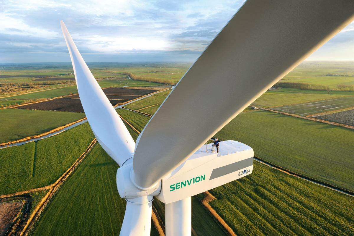 This wind turbine in Husum, Germany, is similar to those proposed for the bluffs between Valmeyer and Fults. The man, who looks tiny next to giant rotors, is providing maintenance.