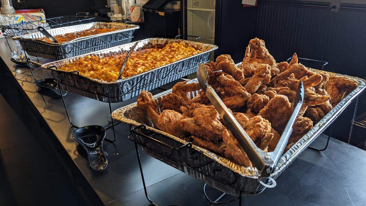 Ray’s served lunch to guests at its Aug. 8 Ribbon-cutting event. The meal consisted of fried chicken, baked mac & cheese and candied yams.