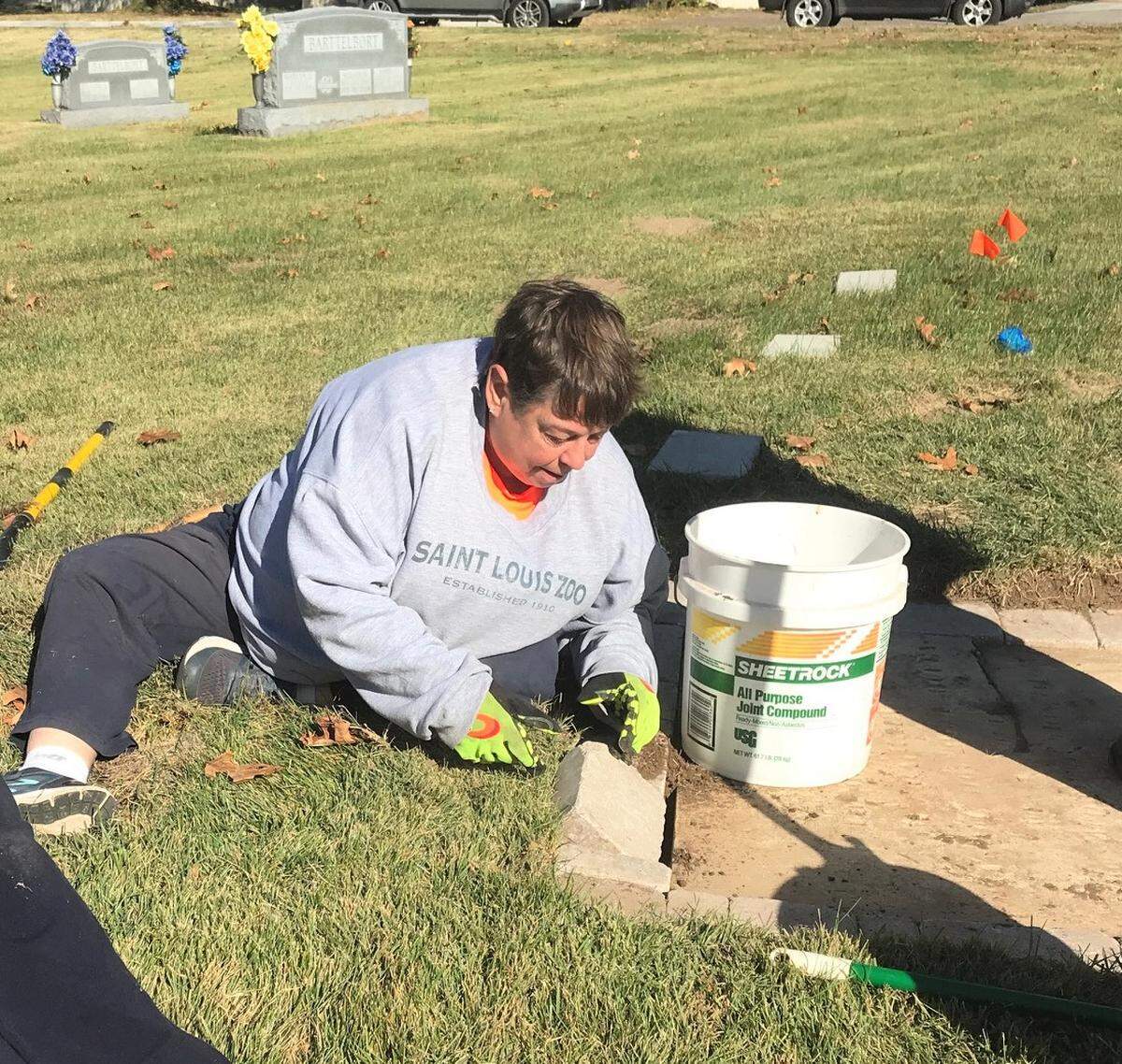 Sharon Danner-Schwartztrauber works on a gravestone.