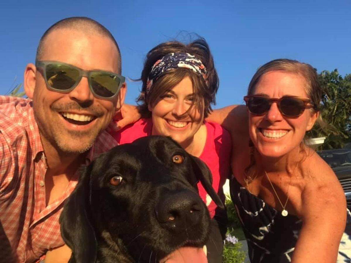 Sarah Delashmit, center, poses with Brian and Liz Hickox during one of her 2019 visits to their Florida vacation home.