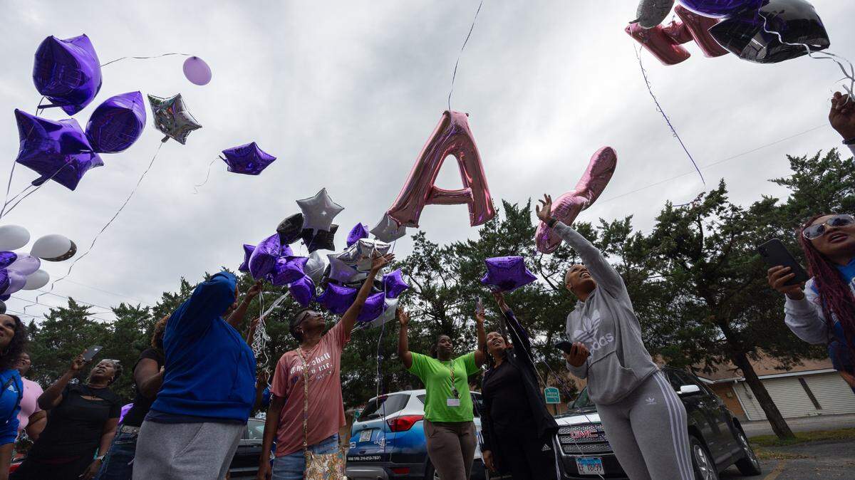Friends, family and coworkers of Latasha Johnson, a victim of an alleged hit-and run Wednesday, release balloons in Cahokia Heights, Ill. on Sept. 13, 2024.