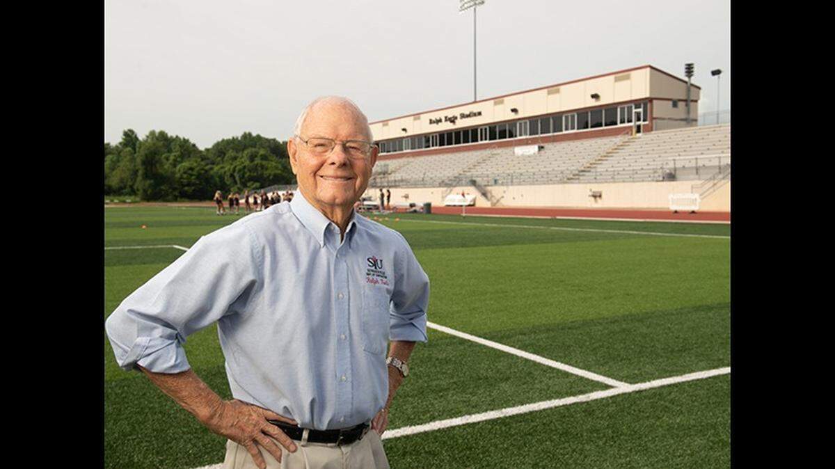Ralph Korte is shown at the stadium that bears his name at Southern Illinois University Edwardsville. As a young contractor and father, he took night classes for nine years to earn his business degree.