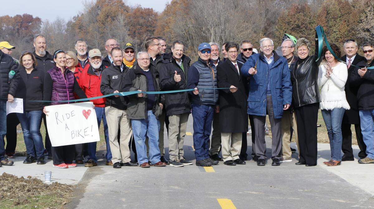 Officials from St. Clair and Madison counties, the Metro East Parks and Recreation board and others cut the ribbon on the new Madison Country Transit District Goshen Trail Extension. The seven-mile trail connects Troy and O’Fallon, linking the two counties together.