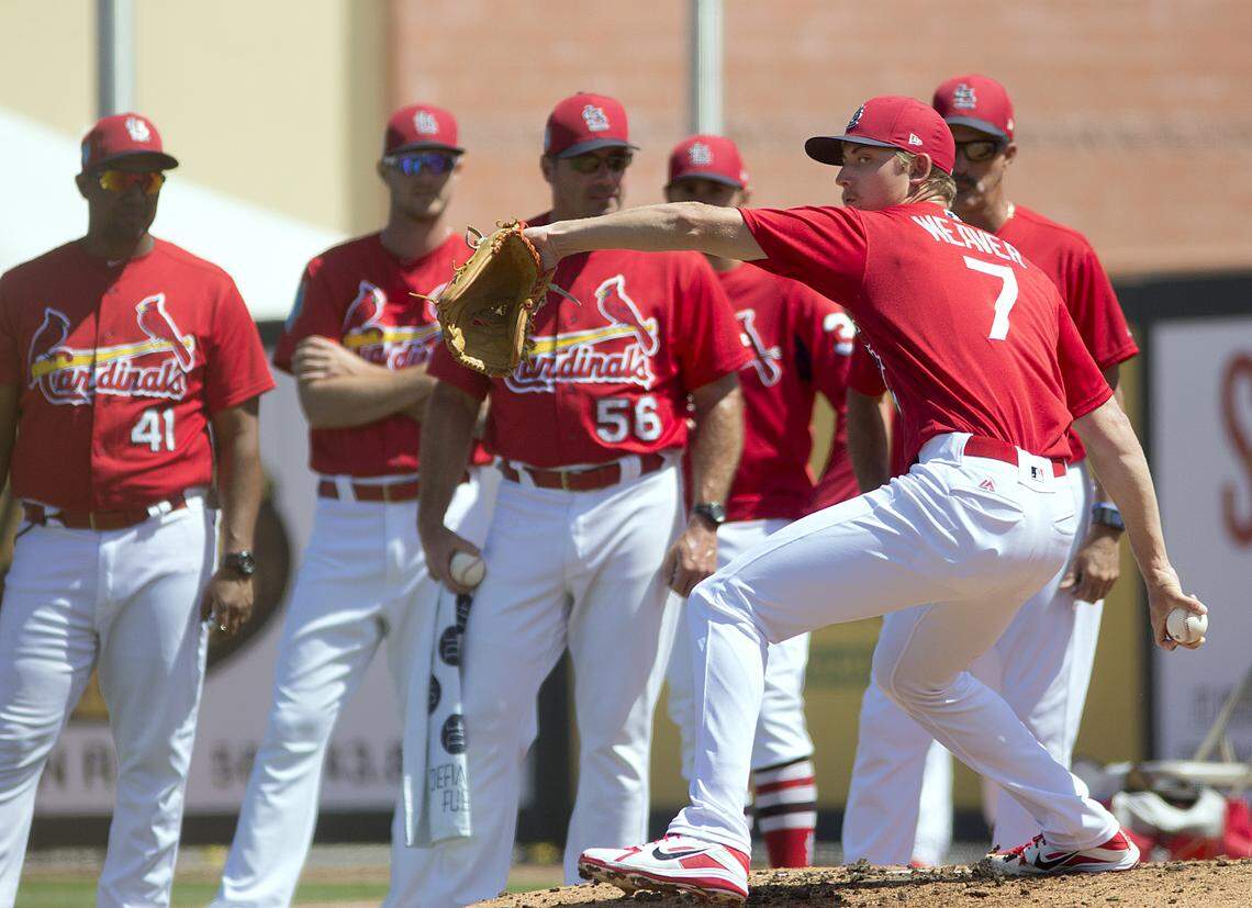 Luke Weaver throws in the bullpen as bullpen coach Kyle Eversgerd, No. 56, and pitching coach Mike Maddux.