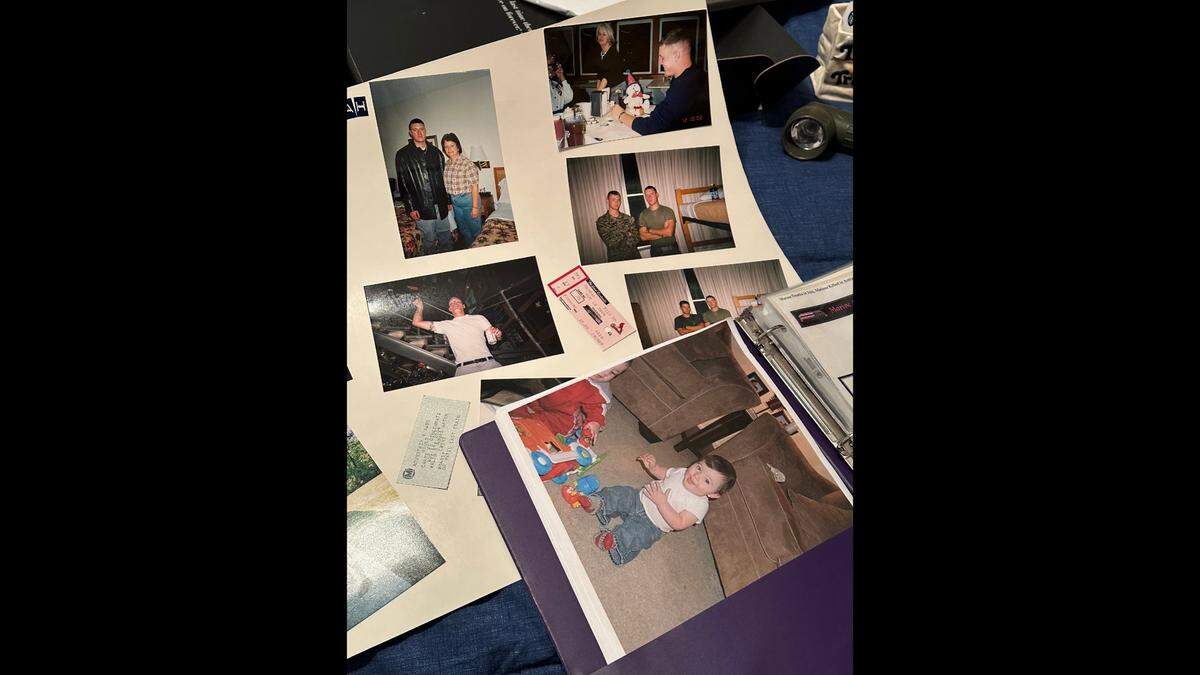 A collage of photos of Mattew Wyatt rests behind a photo of Matthew Ben Schriver on July 15, 2024. Schriver is one of the five or so children named after Matt, and his middle name is a reference to either Cpl. Binh Le, a Vietnamese-American soldier who died with Matt in Iraq, or Ben Theis, Matt’s childhood friend.