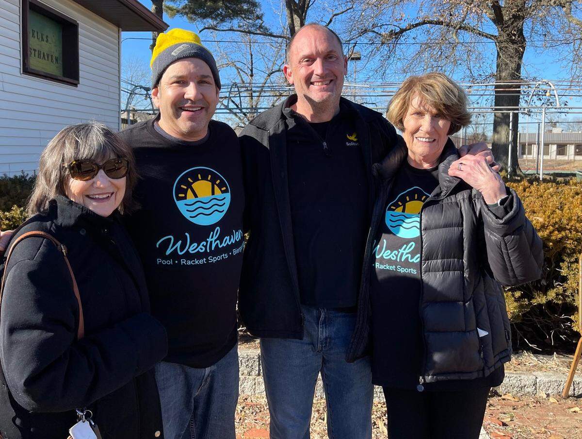 Phil Kammann Jr., second from left, and Greg Stiehl celebrate their purchase of the old Westhaven pool in Belleville with their mothers, Nan Kamman-Judd, left, and Sheron Meyer in February.