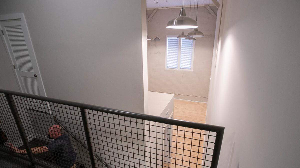 Developers who turned the former Granite City YMCA building into an apartment complex carved five loft-style units out of the former gymnasium. They feature the original brick walls and maple floor.