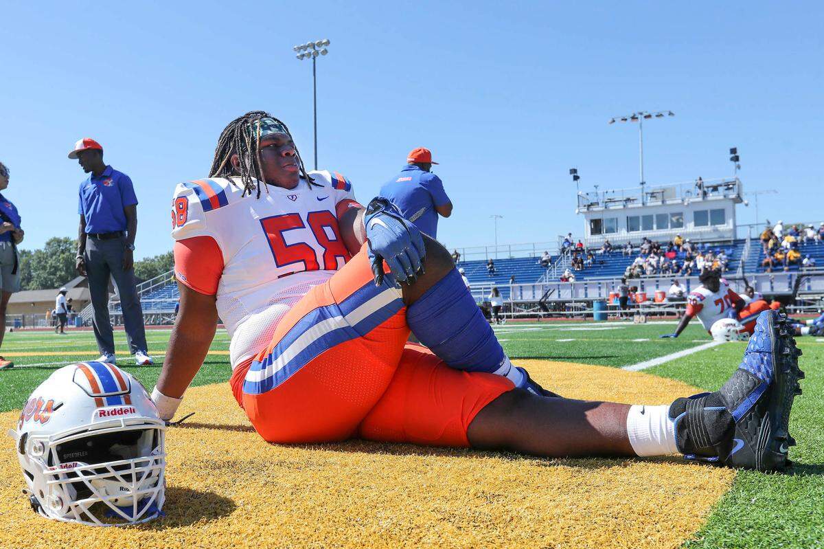 East St. Louis lineman and University of Alabama commit Miles McVay stretches prior to a Southwestern Conference game against O’Fallon earlier this season. The Flyers will face Crete-Monee in an IHSA Class 6A quarterfinal game Saturday.
