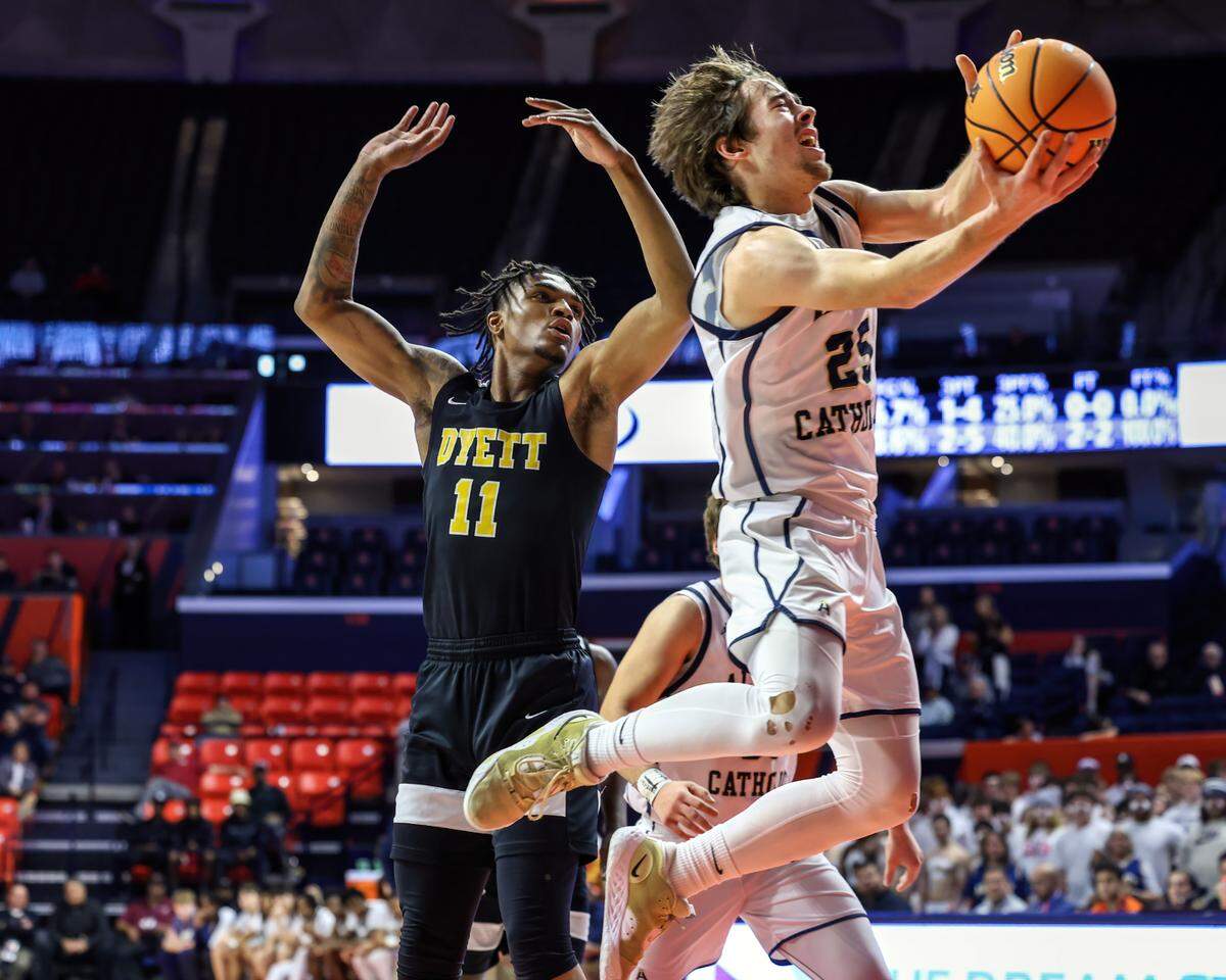 March 15, 2025 - , - Belleville Althoff’s Zach Winkeler drives to the basket during the IHSA, 2A championship game against Chicago (Dyett) at the State Farm Center in Champaign. [Photo: Chris Johns]
