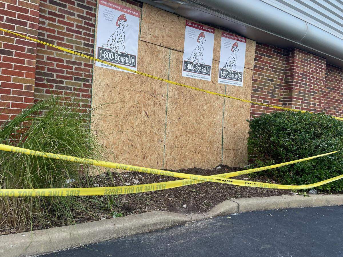 Plywood covers the section of the St. Clair County Regional Office of Education building in Belleville that was struck by an Alternative Transportation System bus late Saturday afternoon.