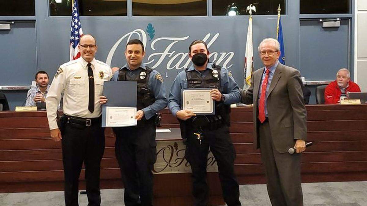 O’Fallon police officers Ben Sosa and Parrish Brito received Lifesaving Awards from the city at a recent council meeting for their efforts on a June 25 medical call. Police Chief Kirk Brueggeman said they arrived on the scene of a subject experiencing a life-threatening medical emergency. Prior to EMS arrival, Sosa, with assistance of Brito, began performing CPR on the patient, who was not conscious and not breathing. They continued CPR until EMS arrived and took over care of the patient. After about six minutes of CPR, the patient began breathing and sat up. The patient suffered from a medical condition. The EMS supervisor said the patient likely would have died without the quick work of Sosa and Brito.