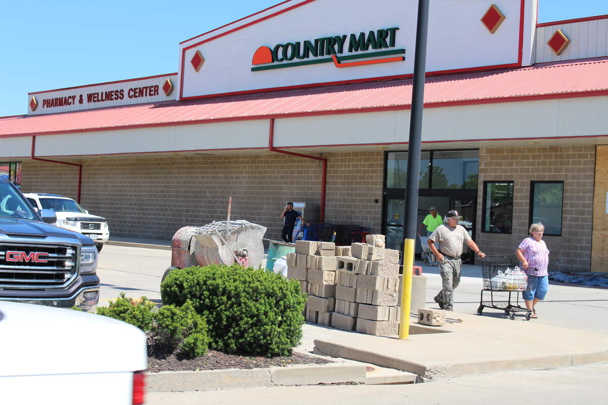 The new Freeburg Country Mart opened Tuesday off State Street, but renovations aren't complete. Workers still are using concrete blocks to fill in an opening left when the door was moved.