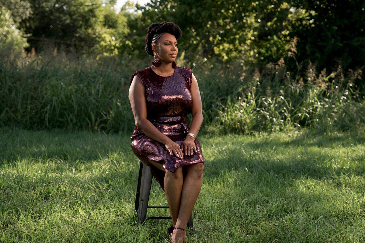 Larita Rice-Barnes, a native of East St. Louis, Illinois, recalls the day she feared for her life in an open field near the city’s main thoroughfare. She ran through the grass before dropping to the ground, where she played dead until the shooting stopped. That moment informs her work as she rallies for peace in the city. (Whitney Curtis for KHN)