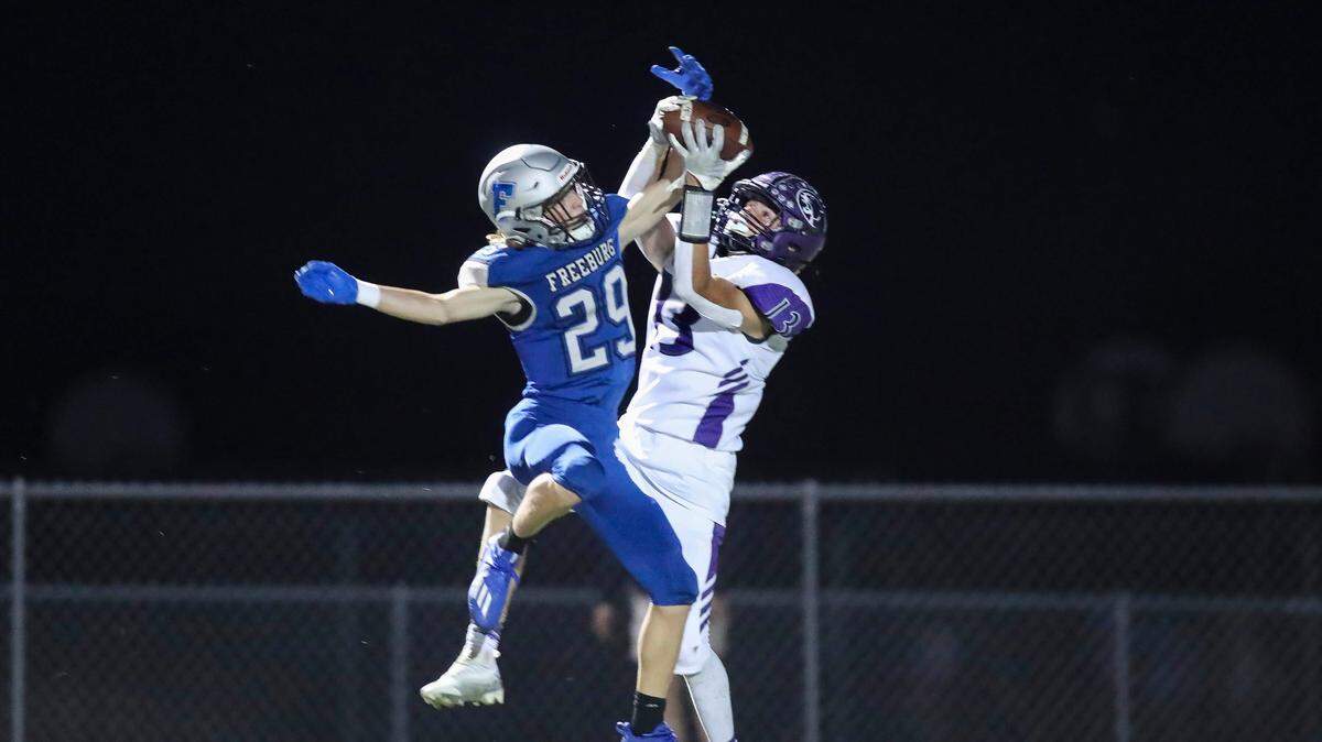 Breese Central’s Braden Revermann (13) hauls in a Conner Freeze touchdown pass against Freeburg on Sept. 16. Revermann is the winner of the latest Belleville News-Democrat Player of the Week high school poll, as selected by readers of bnd.com.