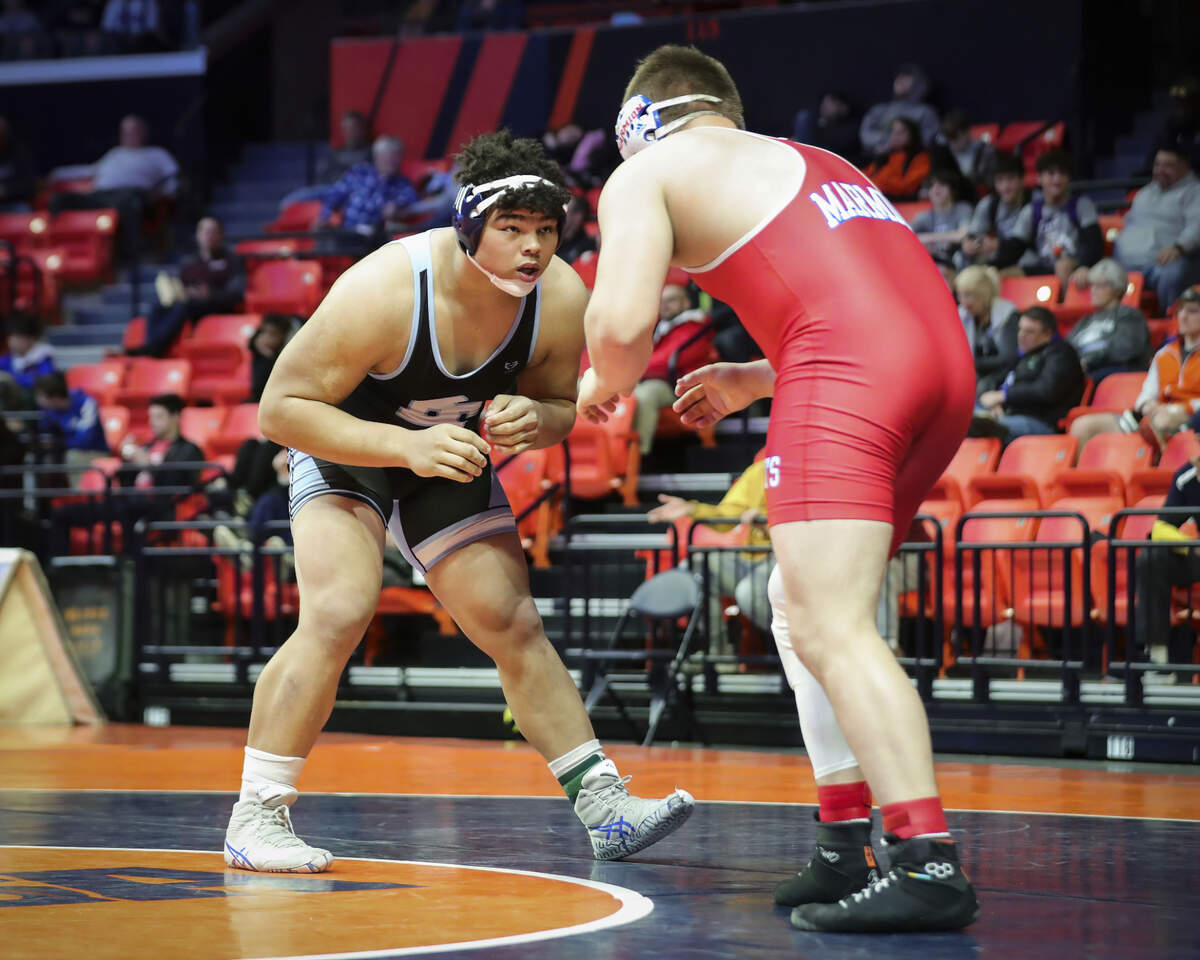 Belleville East’s Jonathan Rulo wrestles Marmion Academy’s Sean Scheck during their quarterfinal match at the 2023 IHSA Individual Wrestling State Finals on Friday. Rulo won by fall at 3:17.