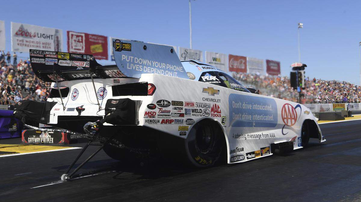 In this photo provided by the NHRA, Robert Hight secures the category points lead to defeat Tim Wilkerson at and pick up his third victory for the year and 10th Countdown to the Championship win of his career Sunday at the AAA Insurance NHRA Midwest Nationals at Gateway Motorsports Park in Madison.