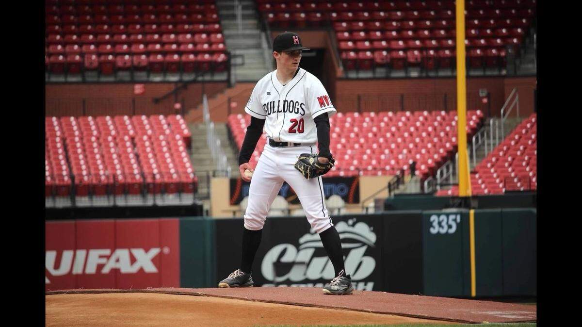 Highland High School 2024 graduate Trent Clemons pitching a game for the Bulldogs at Busch Stadium in St. Louis during his junior season in April 2023.