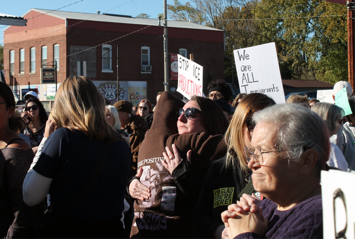 Rebecca Scheller, of Staunton, hugs her mom after listening to Ismael Ayuzo Sandoval’s daughter talk about his arrest by U.S. Immigration and Customs Enforcement during a rally Sunday.