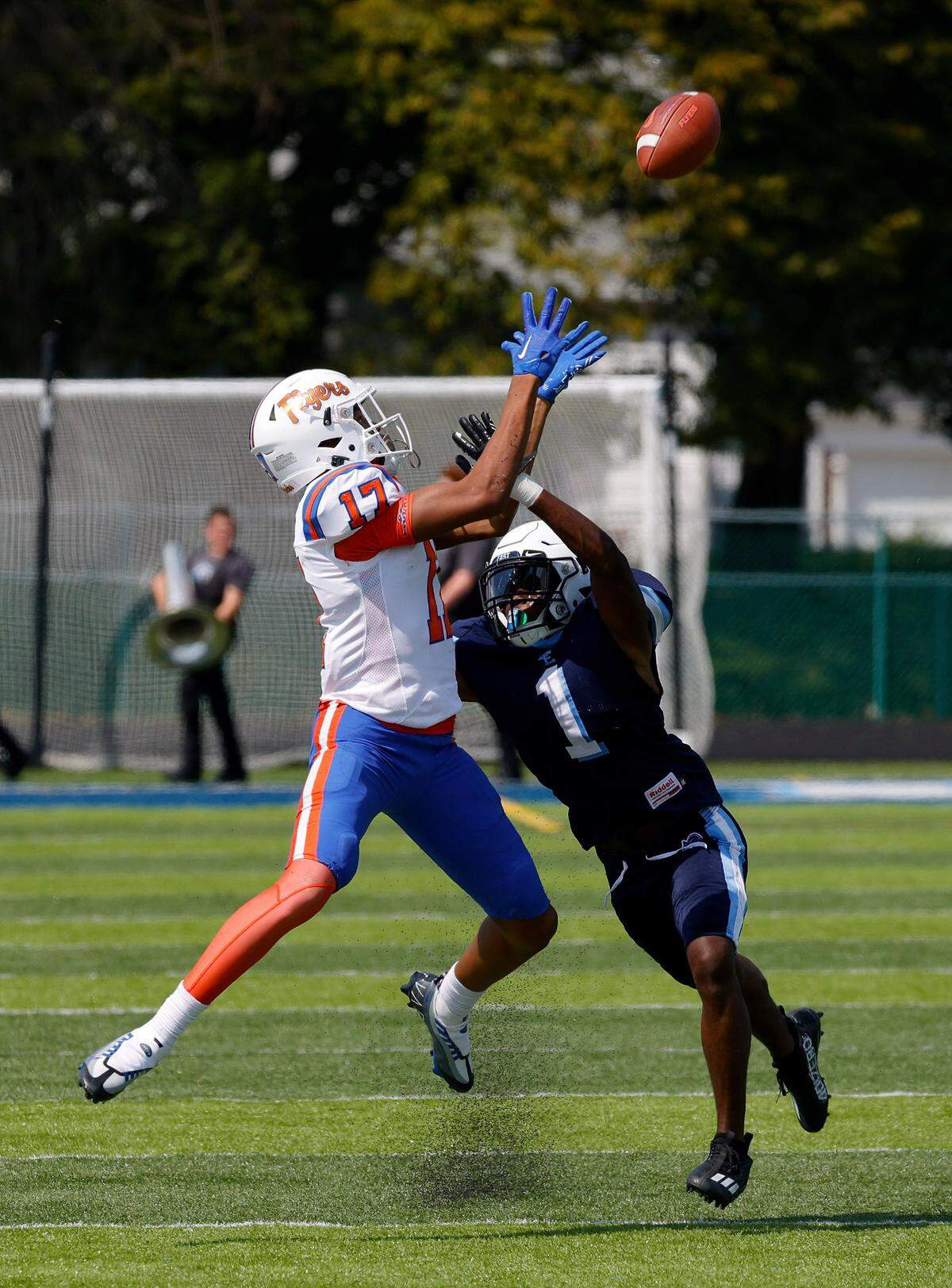East St. Louis Marlon Fluker wide receiver makes the catch against Belleville East’s Sonny McGill (1) during a Southwestern Conference game Saturday at East. The Flyers coasted to a 57-0 triumph.
