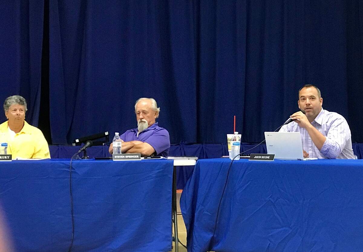 From left, O'Fallon School District 90 board members Becky Drury, Steve Springer and Jason Boone during the June 19 board meeting at Fulton Jr. High.