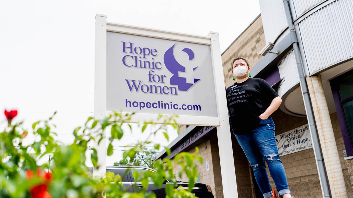 Hannah Dismer, a social worker at the Hope Clinic for Women, stands in front of the reproductive health center on May 19 in Granite City.