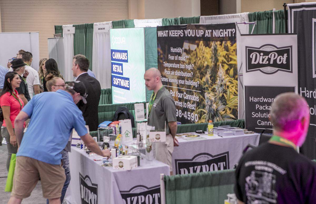 Attendees of the Cannabis Industrial Marketplace Expo’s exhibition floor browse companies representing all facets of the cannabis industry, including security, software, production, legal, dispensary, and cultivation.