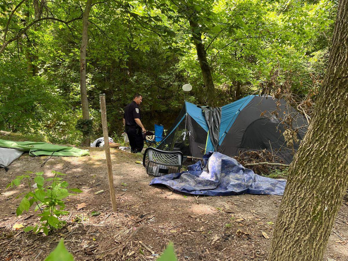 Swansea Police Chief Matt Blomberg returns to a squatters camp along the MetroBikeLink Trail last week to see if people had left after receiving a notice from code-enforcement officials to vacate.