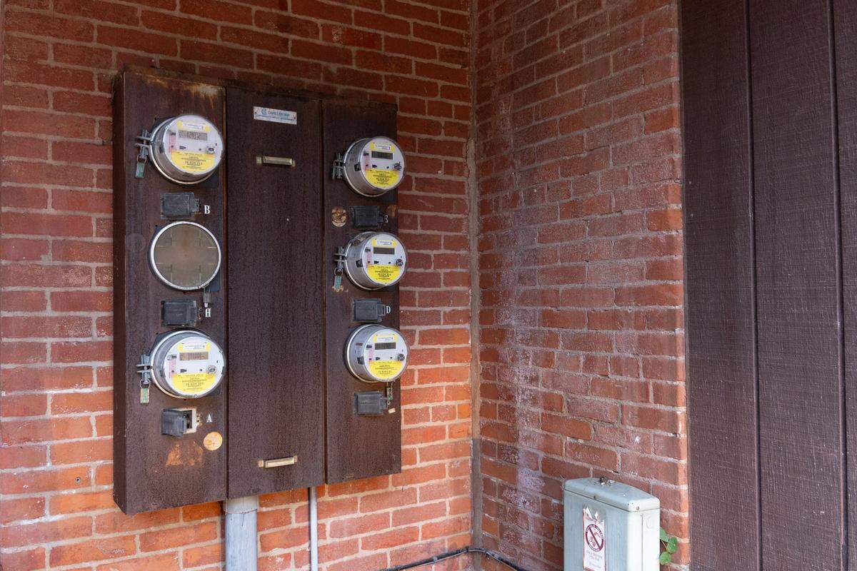 Five electrical meters were shown in a real-estate listing for a brick building at 224 S. Charles St. in Belleville that used to be zoned multifamily, but that listing also described it as a “single-family residence.”