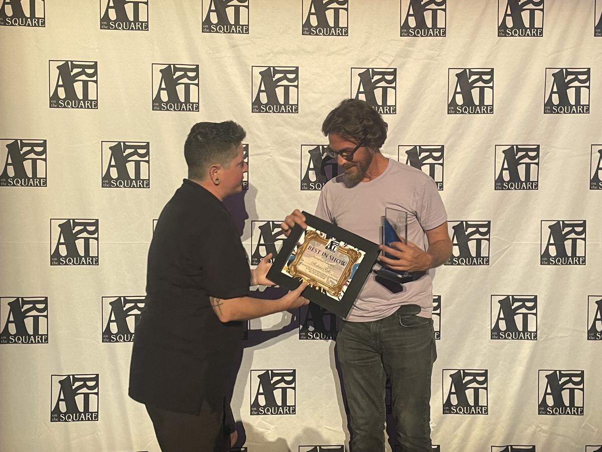 St. Louis-based artist Andrew Rola is presented with the 2026 Art on the Square Best in Show award.