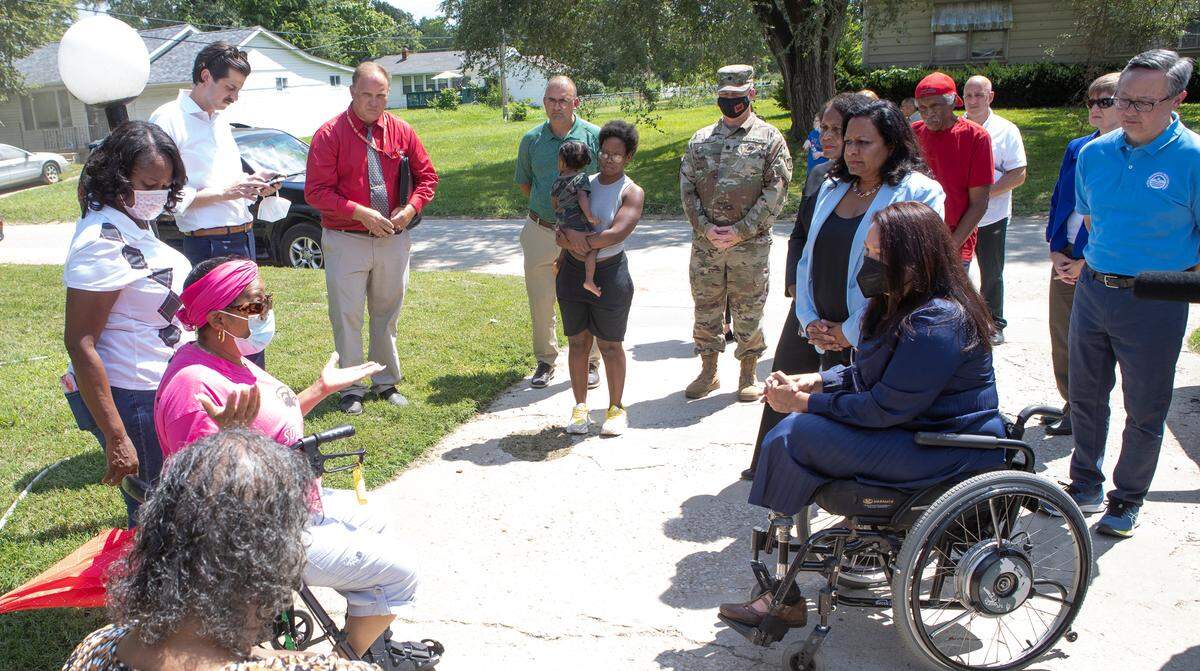 U.S. Senator Tammy Duckworth (D-IL) speaks with Cahokia Heights residents, including Yvette Lyles, during a visit to a neighborhood that has persistent sewer and flooding issues. Sen. Duckworth was joined by state and federal representatives that will help oversee the funding and implementation of the future projects to help address the sewer issues in the neighborhood.