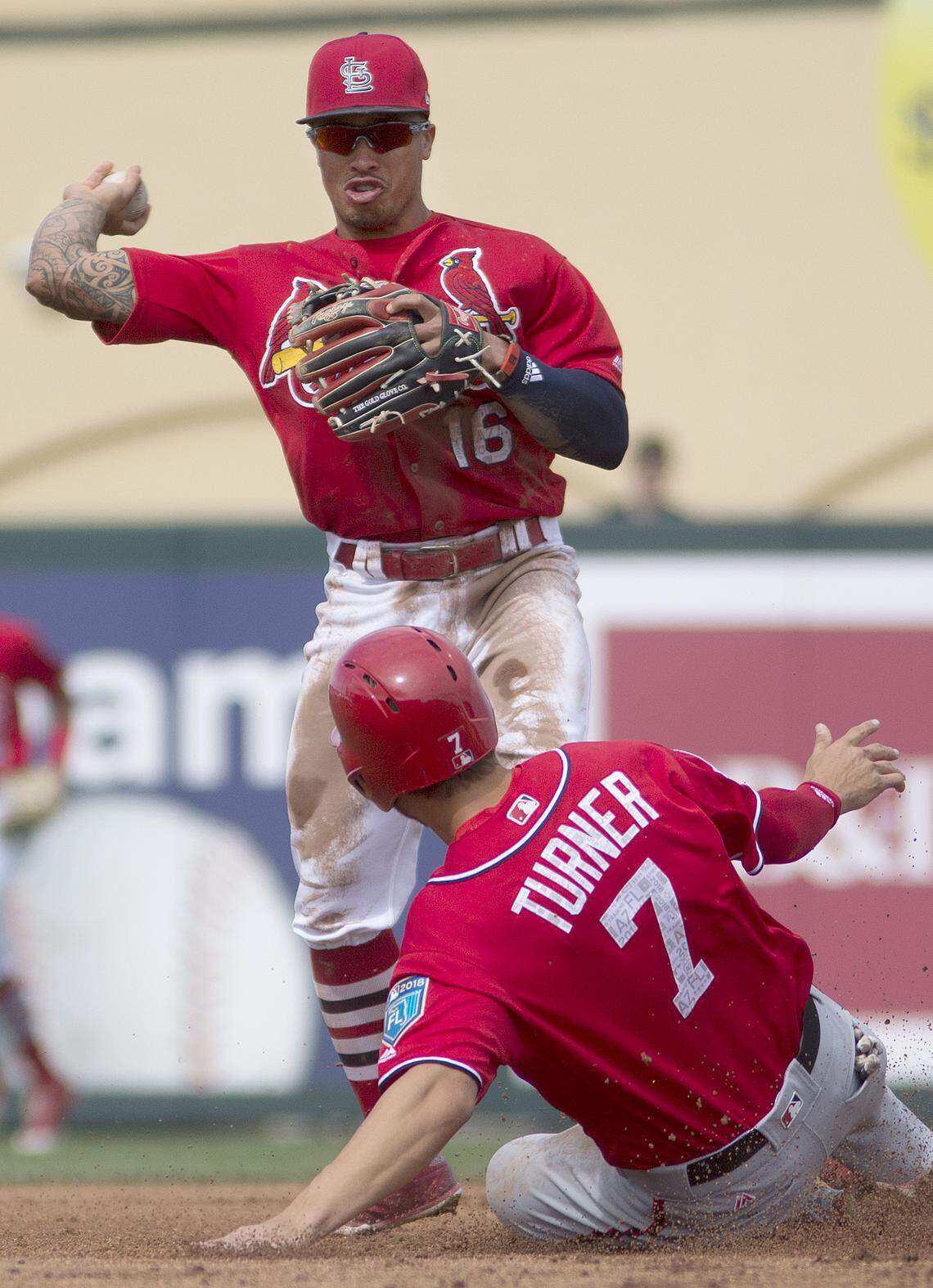 Cardinals second baseman Kolten Wong turns a double play during a spring training game against the Washington Nationals at Roger Dean Stadium in Jupiter Florida. Wong missed out on his first Gold Glove Award despite leading National League second basemen in several defensive metrics.