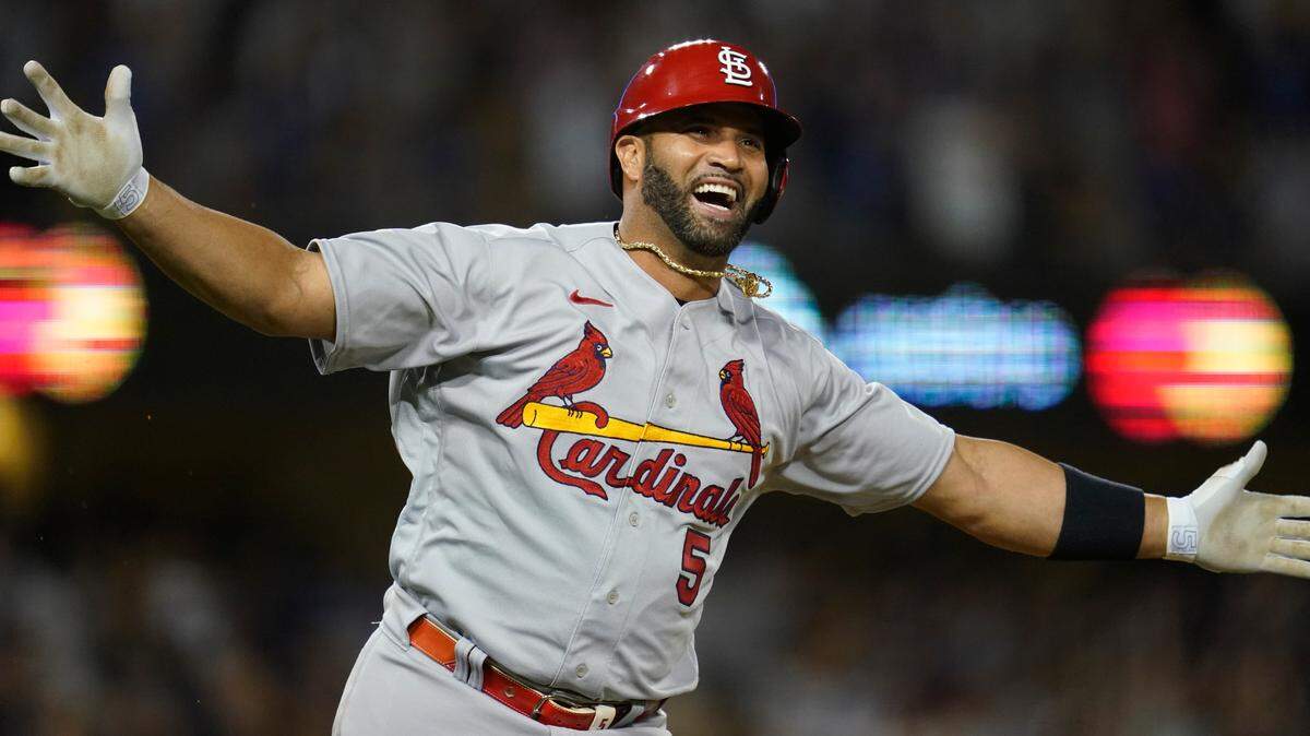 St. Louis Cardinals designated hitter Albert Pujols reacts after hitting a home run during the fourth inning of a baseball game against the Los Angeles Dodgers in Los Angeles, Friday, Sept. 23, 2022. Brendan Donovan and Tommy Edman also scored. It was Pujols’ 700th career home run and the Cardinals won the game 11-0.