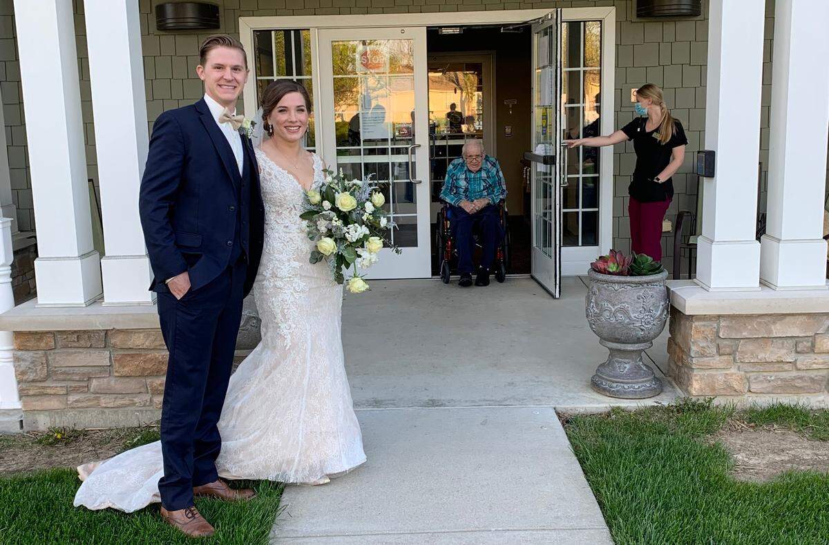 Jessica Weier and David Newgent visit Weier’s grandfather Roscoe at Cedarhurst of Shiloh on their wedding day, April 18, 2020.