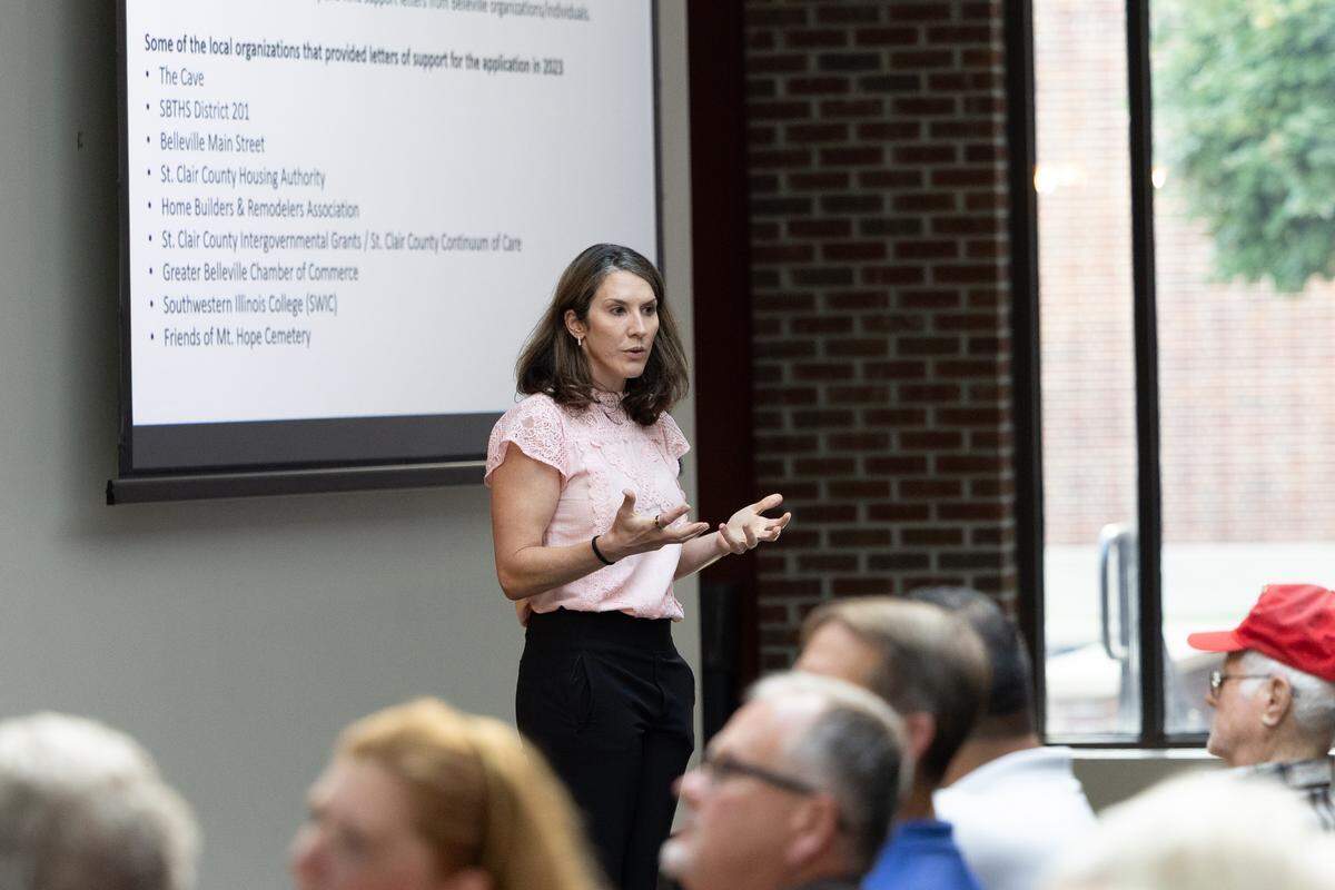 Rachael Cornick, director of operations for Shine Development Partners, speaks to people gathered for a public meeting on the planned Mount Hope Cemetery solar farm on Thursday at the Southwestern Illinois Justice and Workforce Development Campus in Belleville.