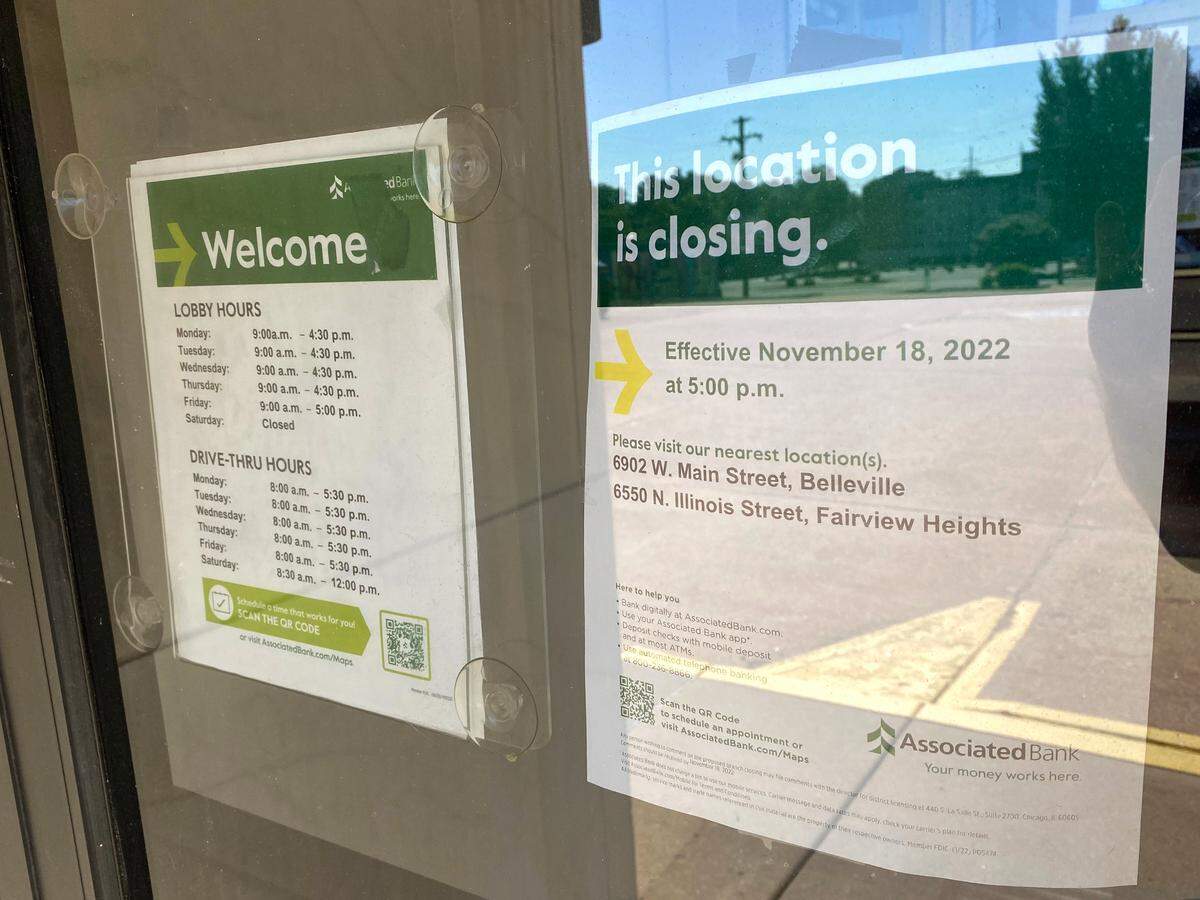 A notice at the Associated Bank location at 100 E. Washington St. in Belleville informing customers of the branch’s closing in November