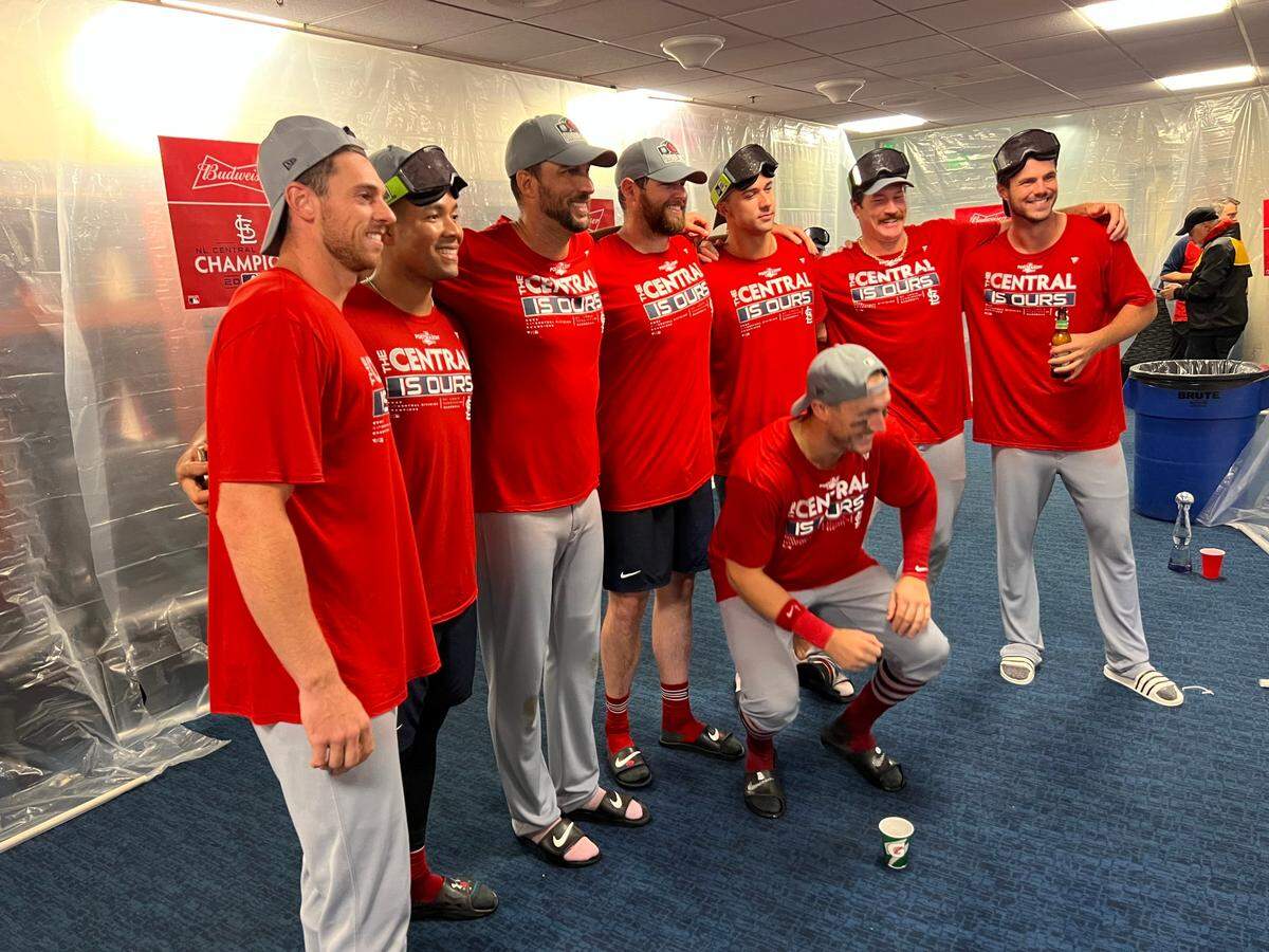 Members of the St. Louis Cardinals are all smiles following the team’s 6-2 victory against Milwaukee on Tuesday night. The win secured the organization’s 12th Central Division crown.