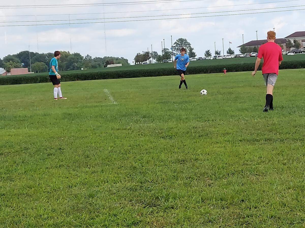 Highland soccer players work on a passing drill near the goal during practice Monday, August 16, at Highland High School. The Bulldogs are hoping to improve upon a 10-15-1 season in 2021 that ended with a double overtime loss to Triad in the IHSA Class 2A regional championship game.
