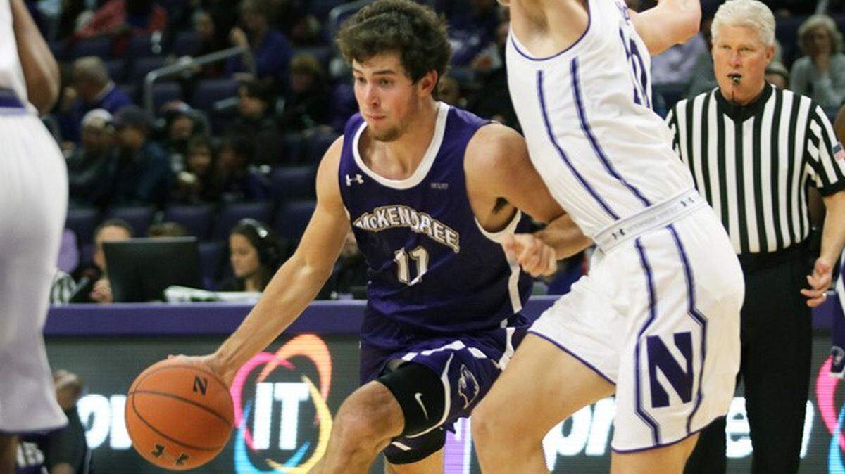 Logan Kohrmann, a member of the McKendree University men’s basketball team, drives to the basket in the teams loss to Michigan Tech.