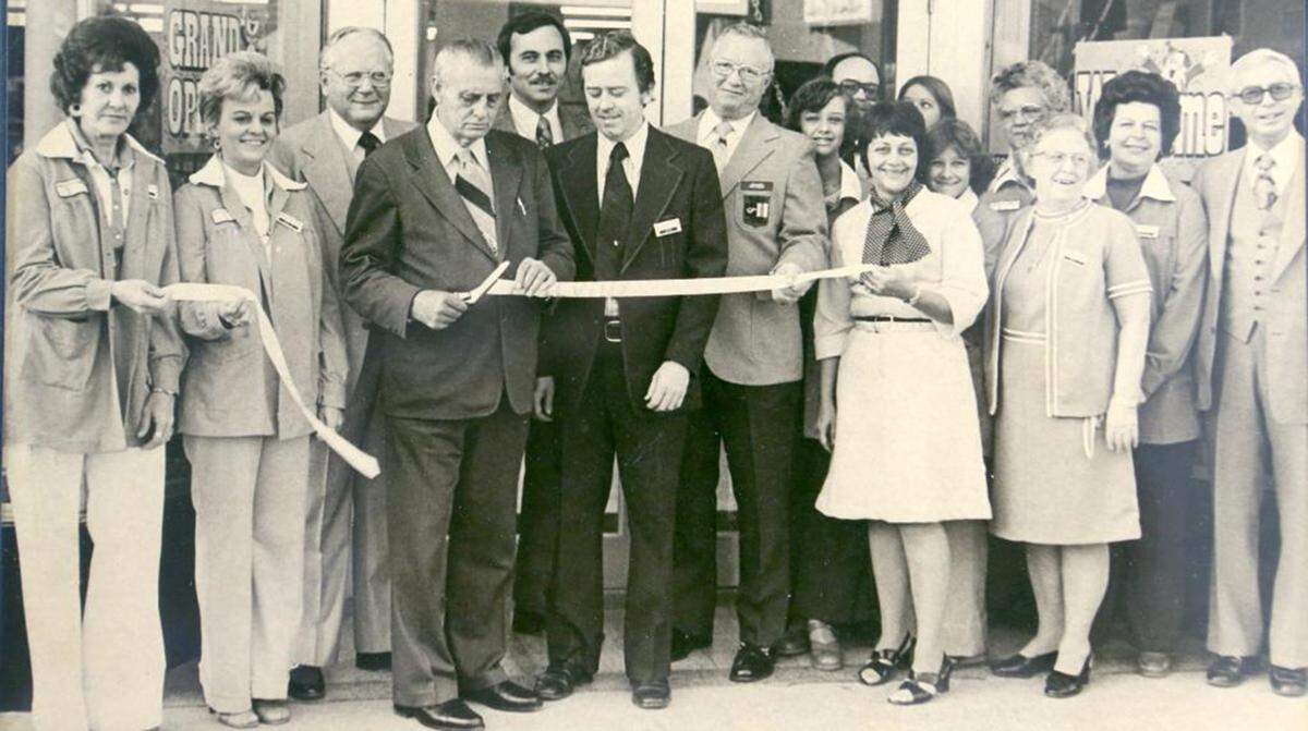 Ben’s owner John Conkright (dark suit and tie in center) watches the ribbon cutting during the grand opening on Ben Franklin in 1976