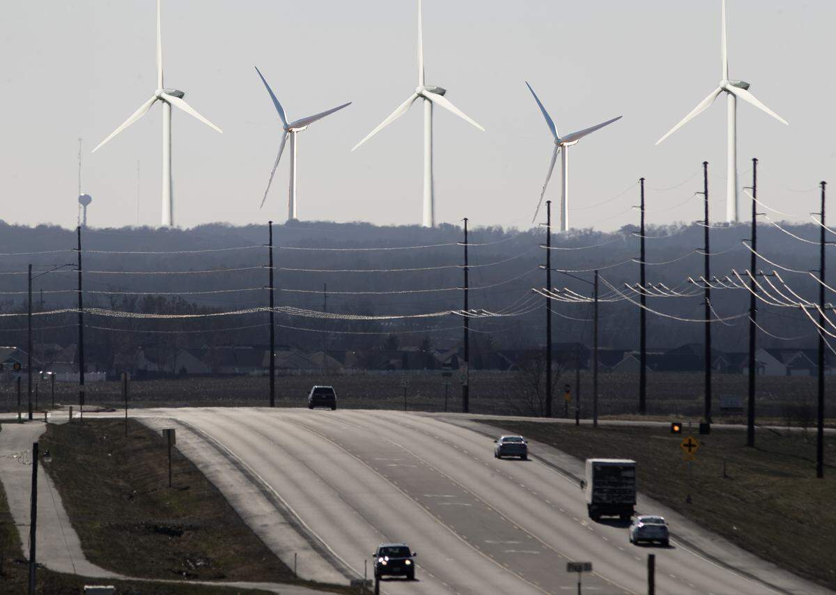 This photo illustration, with a southwest view from Waterloo, shows the size of the proposed 600-foot wind turbines compared to a water tower that is just over 100 feet tall, at middle left.