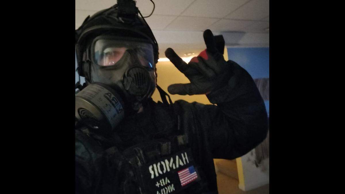 Bailey Hamor posted this photo of himself wearing a gas mask and other combat gear on his Facebook page. He was dressed similarly when he was arrested for allegedly stabbing a man to death on July 20, 2022.