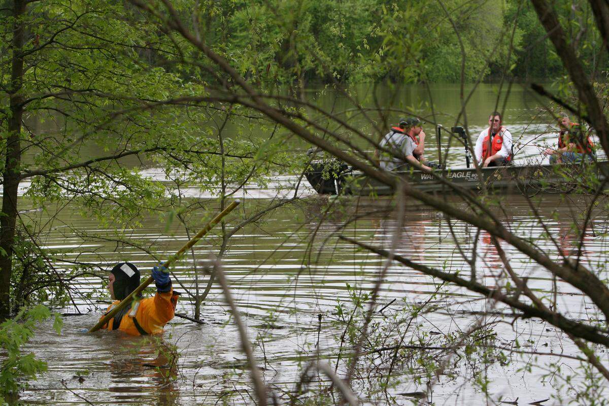 Rescue workers on boats and in water suits searched a flooded area east of Breese for Vince Wesselmann on April 25, 2011 He was last seen walking in his neighborhood on April 21.