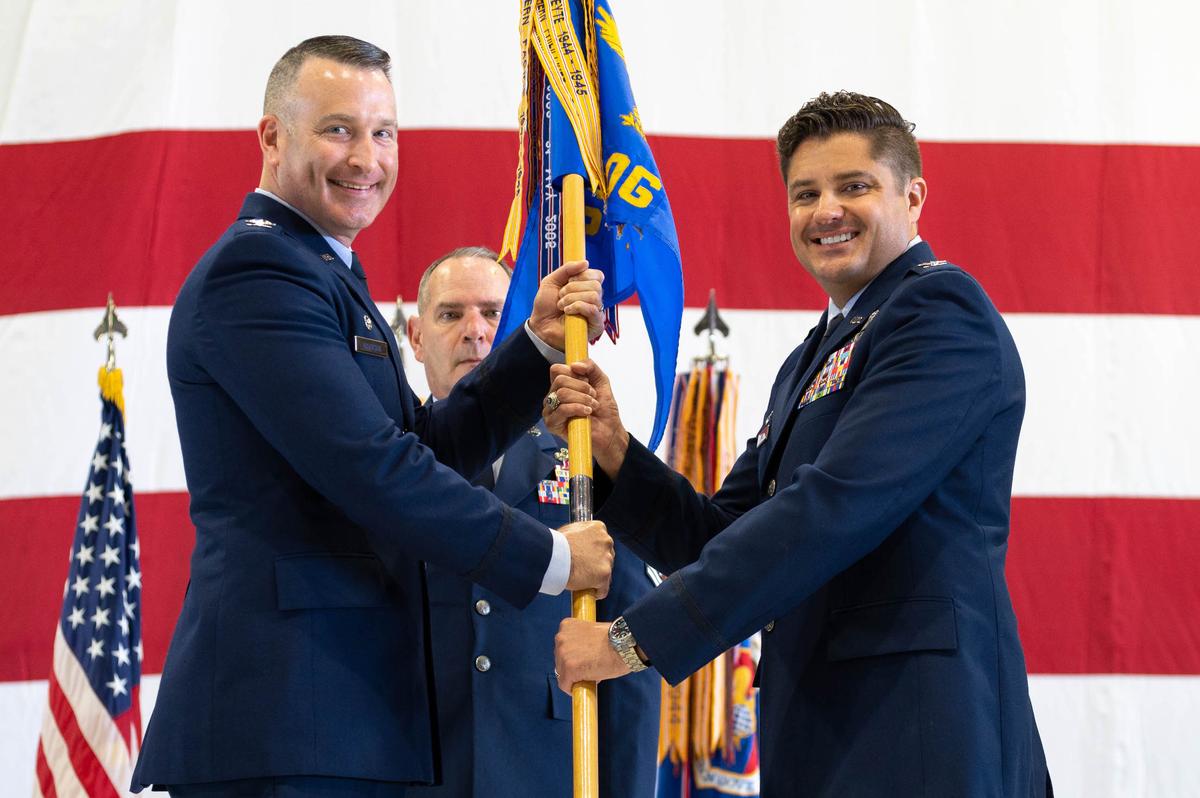 U.S. Air Force Col. Vincent Livie, 375th Operations Group incoming commander, assumes command after receiving guideon from Col. Chris Robinson, 375th Air Mobility Wing commander, during a change of command ceremony on Scott Air Force Base. Livie most recently served as the 618th Air Operations Center director of air refueling on Scott Air Force Base. The primary missions of the group are to provide aeromedical evacuation, aeromedical evacuation training, executive and operational support airlift, flight inspection, and air refueling of critical DoD assets.