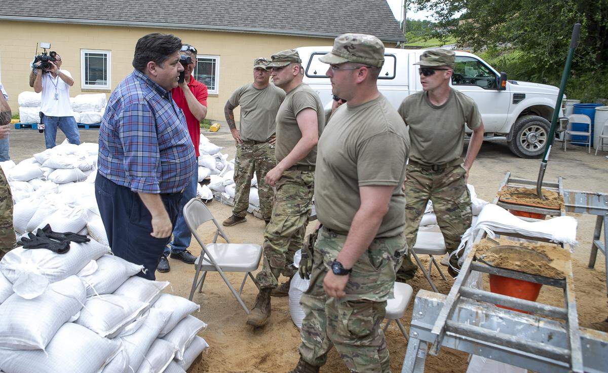 Illinois Governor J.B. Pritzker speaks with National Guardsmen in Grafton. A special National Guard task force has been ordered to head to the metro-east by Gov. J.B. Pritzker. An additional 200 troops will continue to assist defending Illinois cities threatened by the flooding Illinois and Mississippi rivers. In total, more than 400 guardsmen are working against flooding in Illinois.
