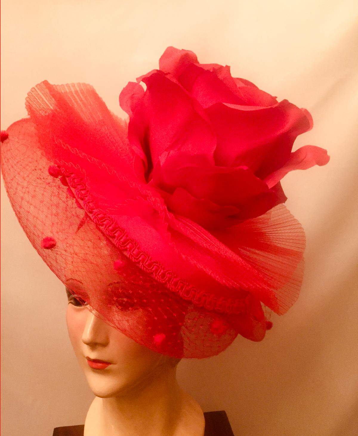 Red Rose Splendor, by Dianne Isbell, is one of the creations featured in “Art is … Wearable,” an exhibit at the Jacoby Arts Center in Alton. The exhibit runs through Sept. 28 and is free and open to the public. www.jacobyartscenter.org