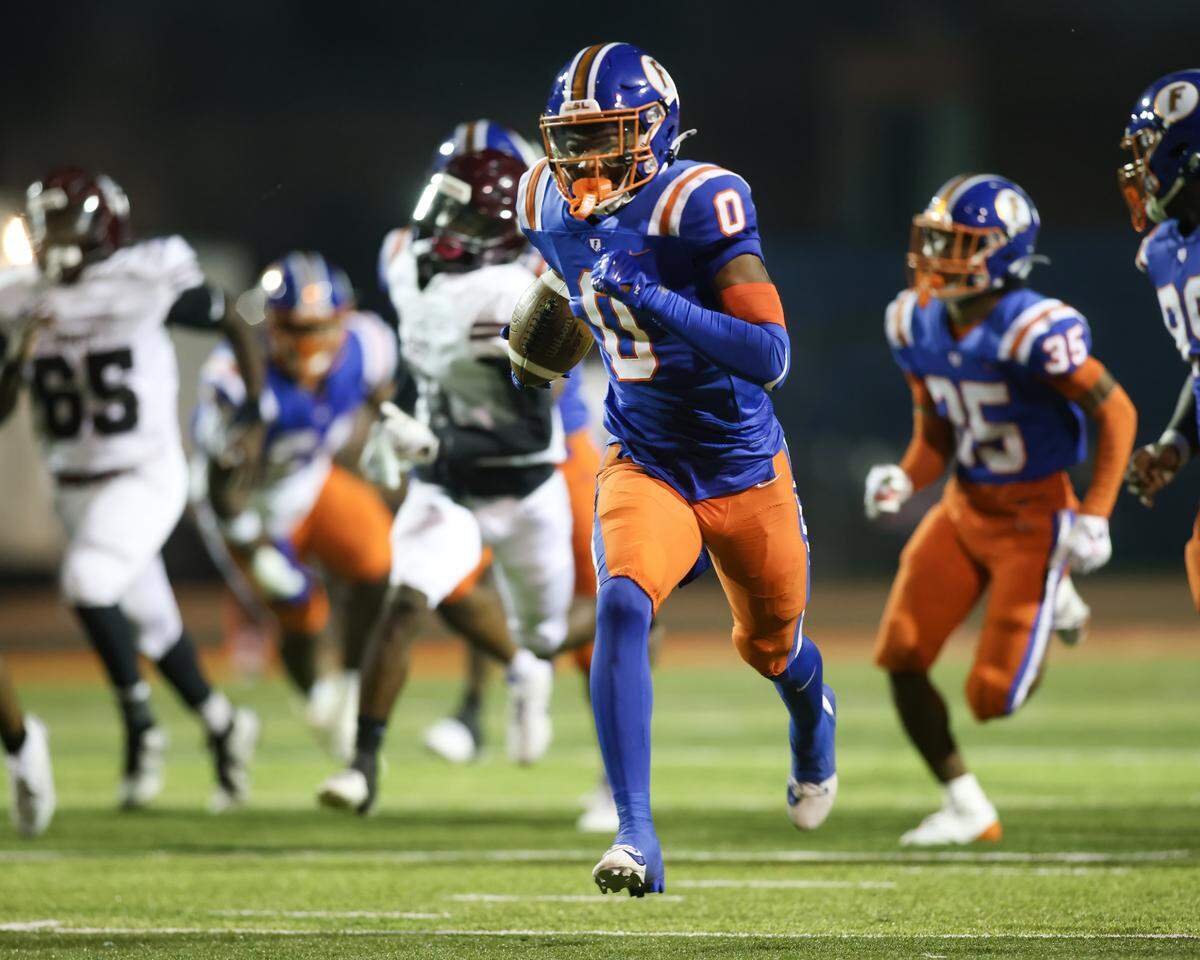 October 4, 2024 - East St. Louis Il, - East St. Louis Charles Bass takes a Belleville West fumble in for a touchdown during Friday night’s Southwestern Conference matchup between Belleville West and East St. Louis. [Photo: Chris Johns]