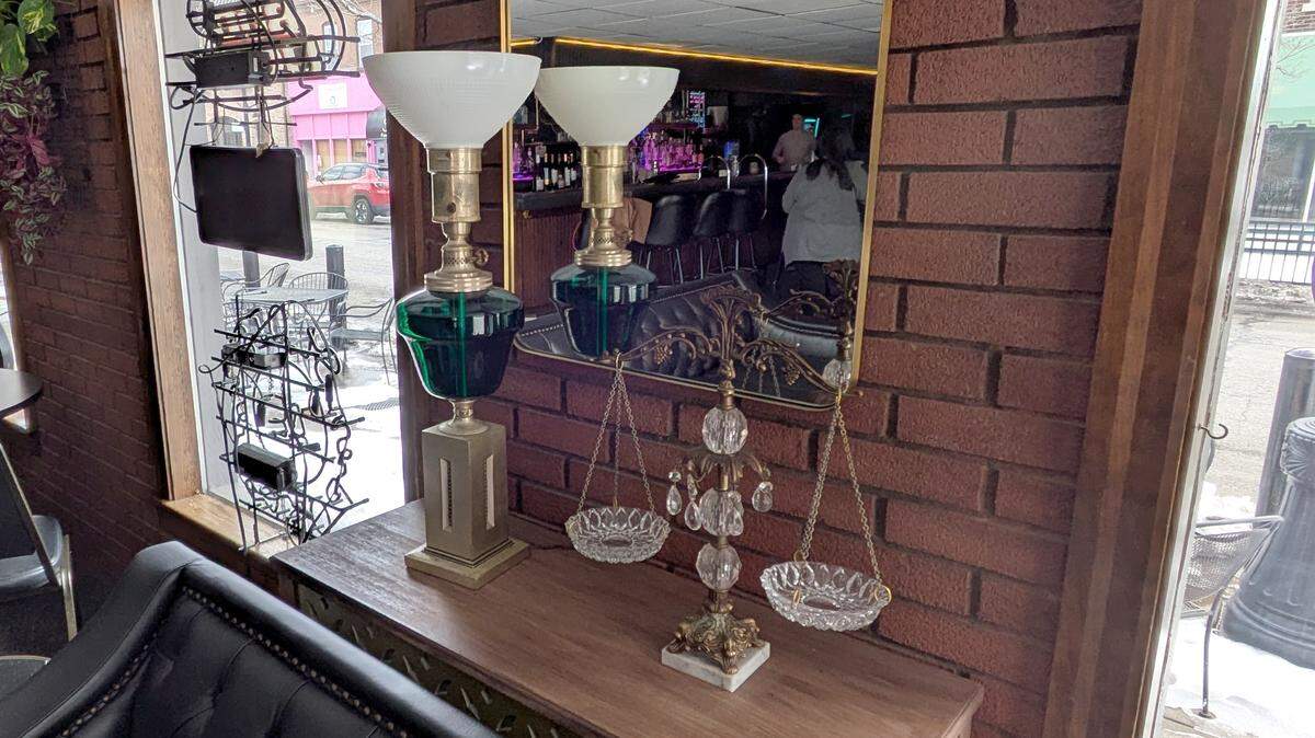 Decorative details at Rachel’s Sidebar include this lamp and a scale.