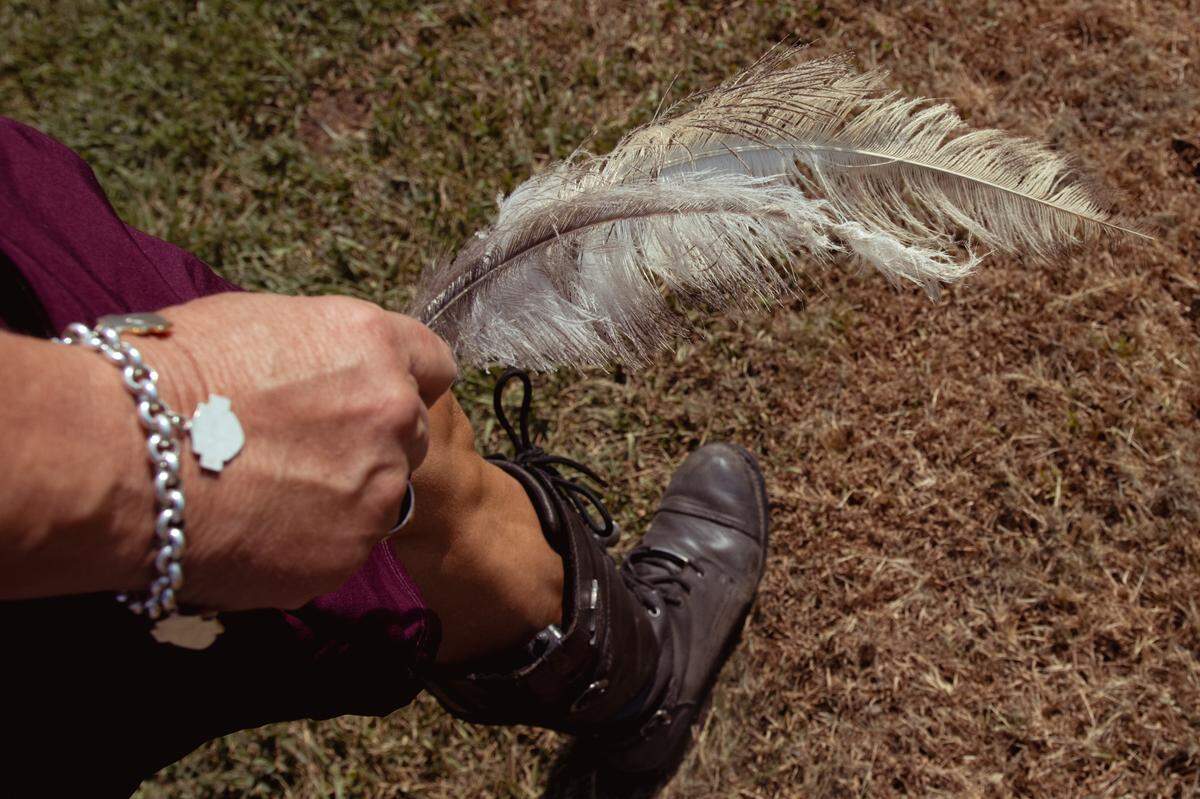 Tina Weber holds an ostrich feather she found on Saturday, Aug. 10, 2024, at Salger’s Ostrich Products in Red Bud, Illinois. “[ A feather] represents freedom, good luck, and angels watching over me,” she said. “I live in faith&nbsp;—&nbsp;it is my everything.”