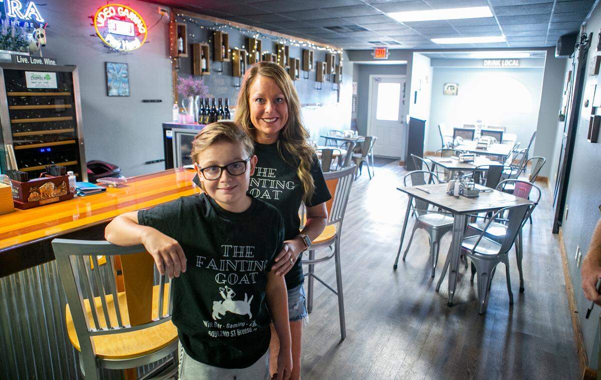 Ashley Driemeyer, co-owner of The Fainting Goat, and her son, Dalton, pose at their Breese location in September after deciding to stay open for indoor dining, despite a COVID-19 ban. Illinois State Police later issued a ticket.